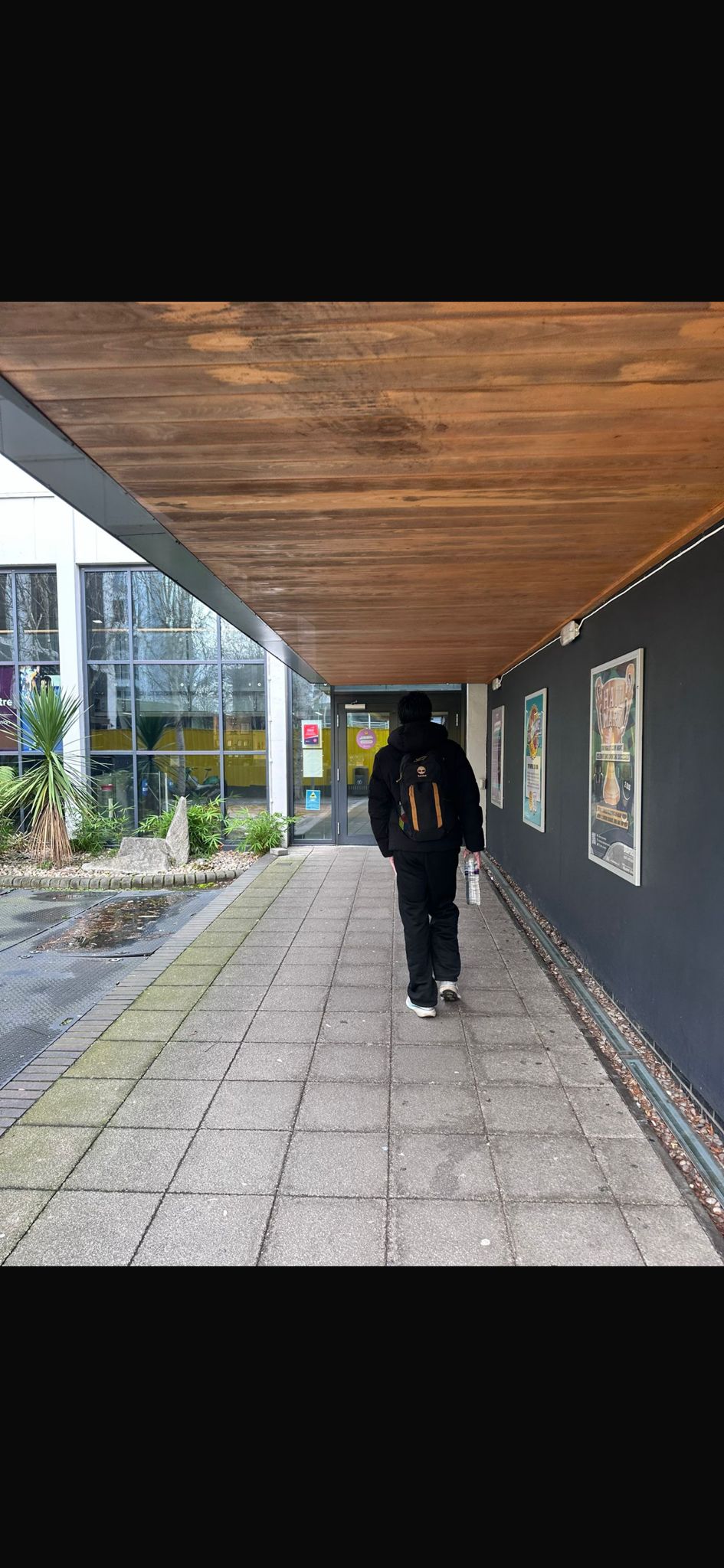 Covered walkway towards Qmotion sports centre entrance